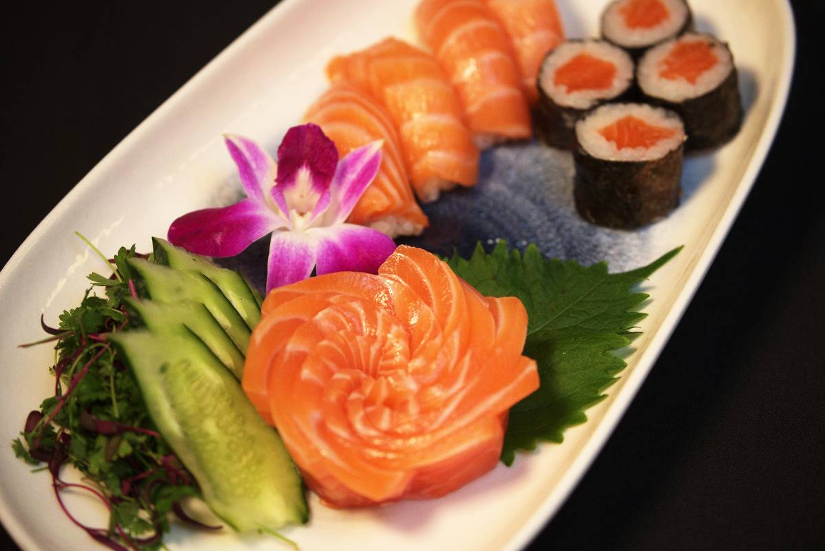 Assorted sushi menu items with rolls, nigiri, and sashimi at Kingdom Sushi